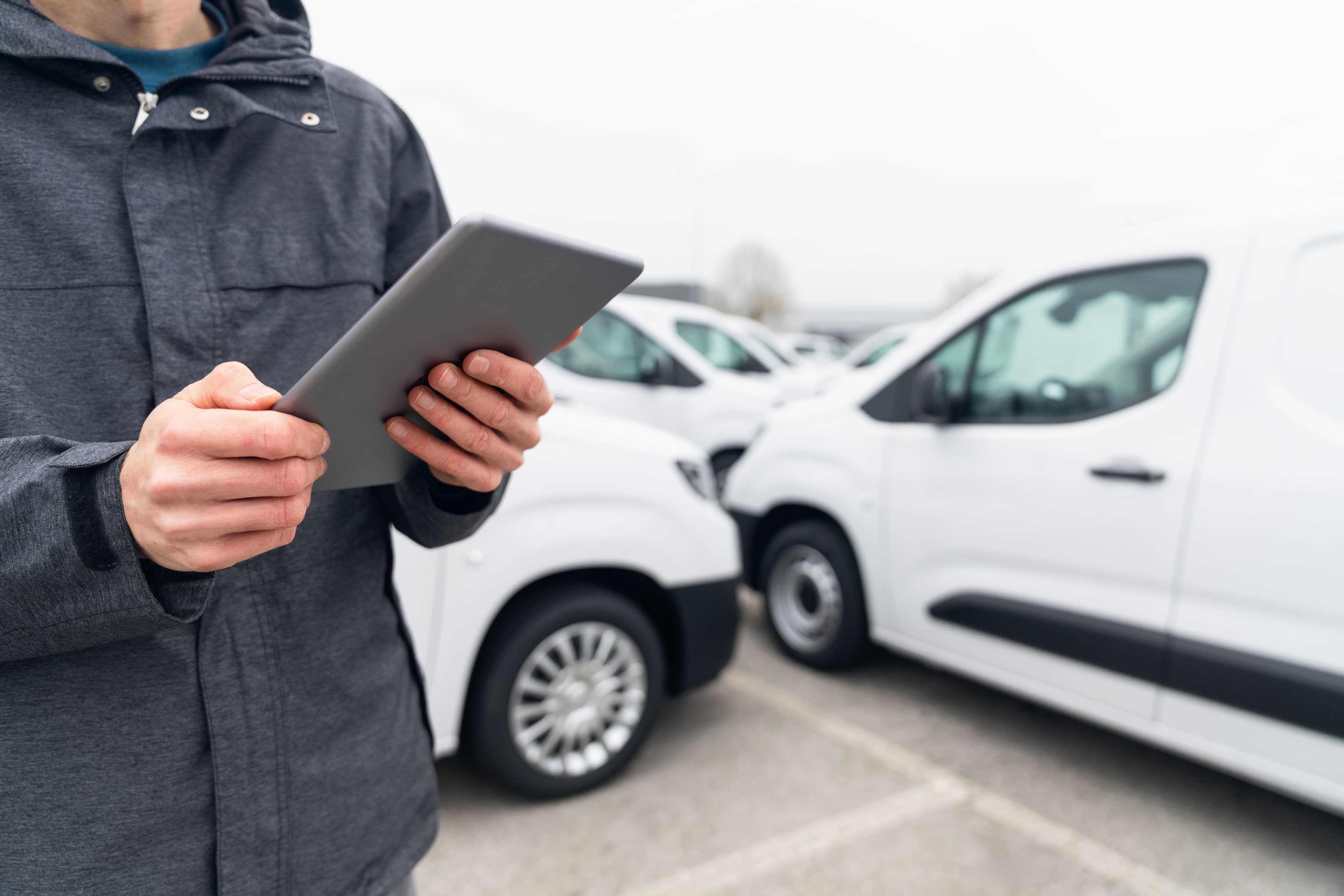Fleet manager with white vans